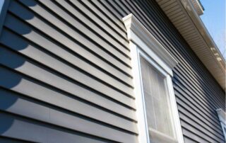 A house with light blue vinyl siding near Lexington, Kentucky (KY)