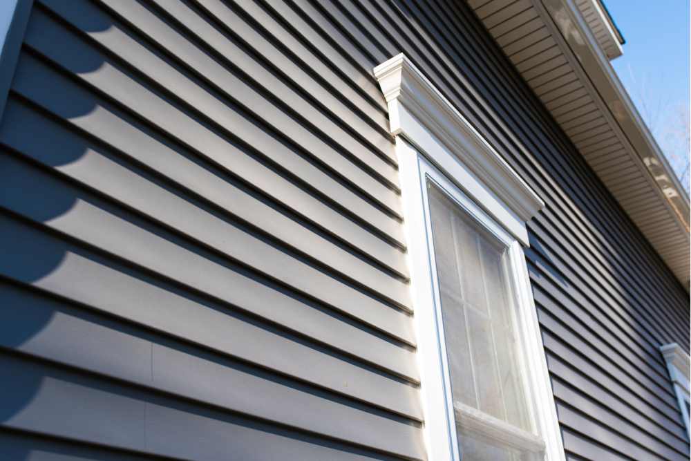 A house with light blue vinyl siding near Lexington, Kentucky (KY)