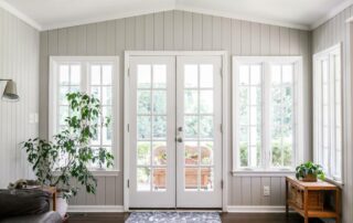 Elegant home living room interior with a set of white French doors near Lexington, KY