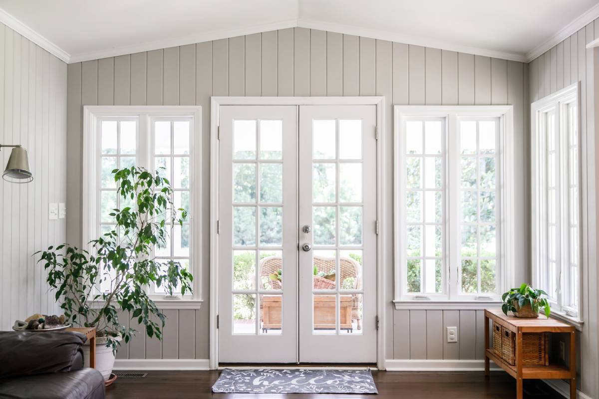 Elegant home living room interior with a set of white French doors near Lexington, KY