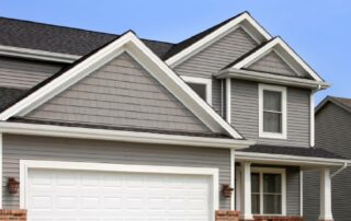 New suburban home with grey vinyl siding near Lexington, KY