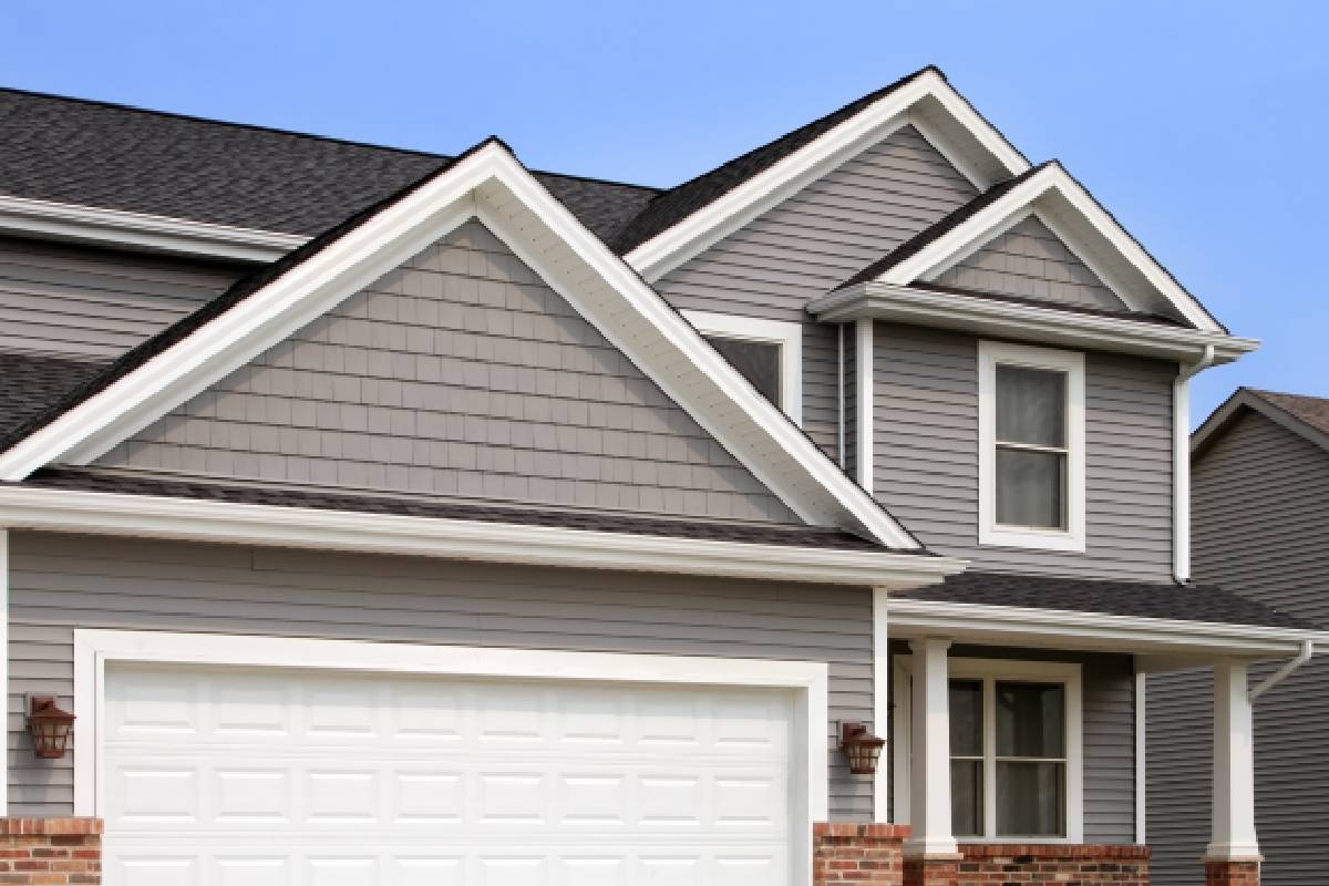 New suburban home with grey vinyl siding near Lexington, KY