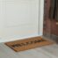 A properly and snugly installed bottom seal on a front door with a welcome mat at Gilkey Windows & Exterior Solutions near Lexington, KY