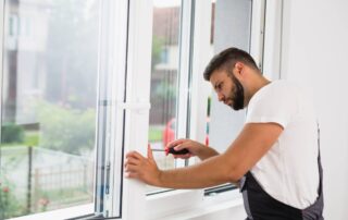 A window specialist working on a client's home by installing new windows near Lexington, KY
